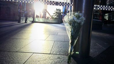 IN PICTURES: Sea of flowers laid in tribute to siege victims in Martin Place (Gallery)