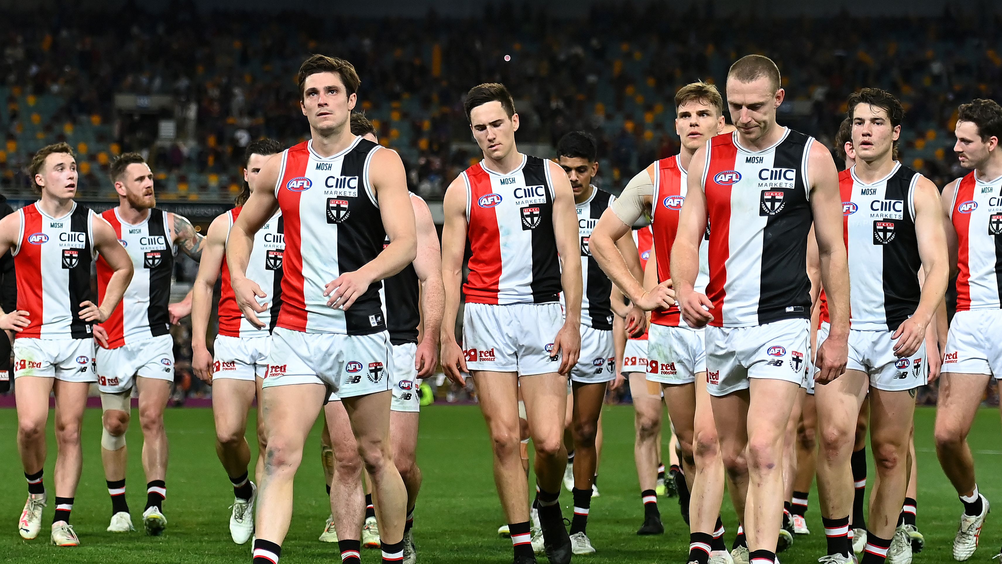 BRISBANE, AUSTRALIA - AUGUST 26: Saints leave the field after their defeat during the round 24 AFL match between the Brisbane Lions and St Kilda Saints at The Gabba, on August 26, 2023, in Brisbane, Australia. (Photo by Albert Perez/AFL Photos via Getty Images)