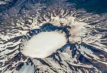 What term denotes a volcanic crater formed after a magma chamber is emptied?