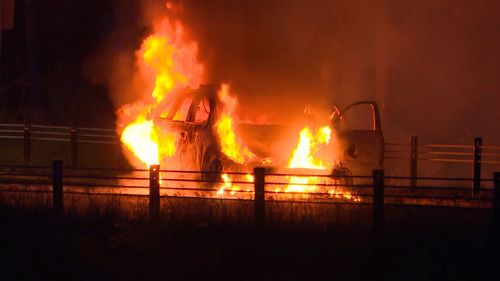 The officers pulled the car over and escaped the vehicle just as flames emerged from beneath the Sorrento's hood, NSW Police reports. (9NEWS)