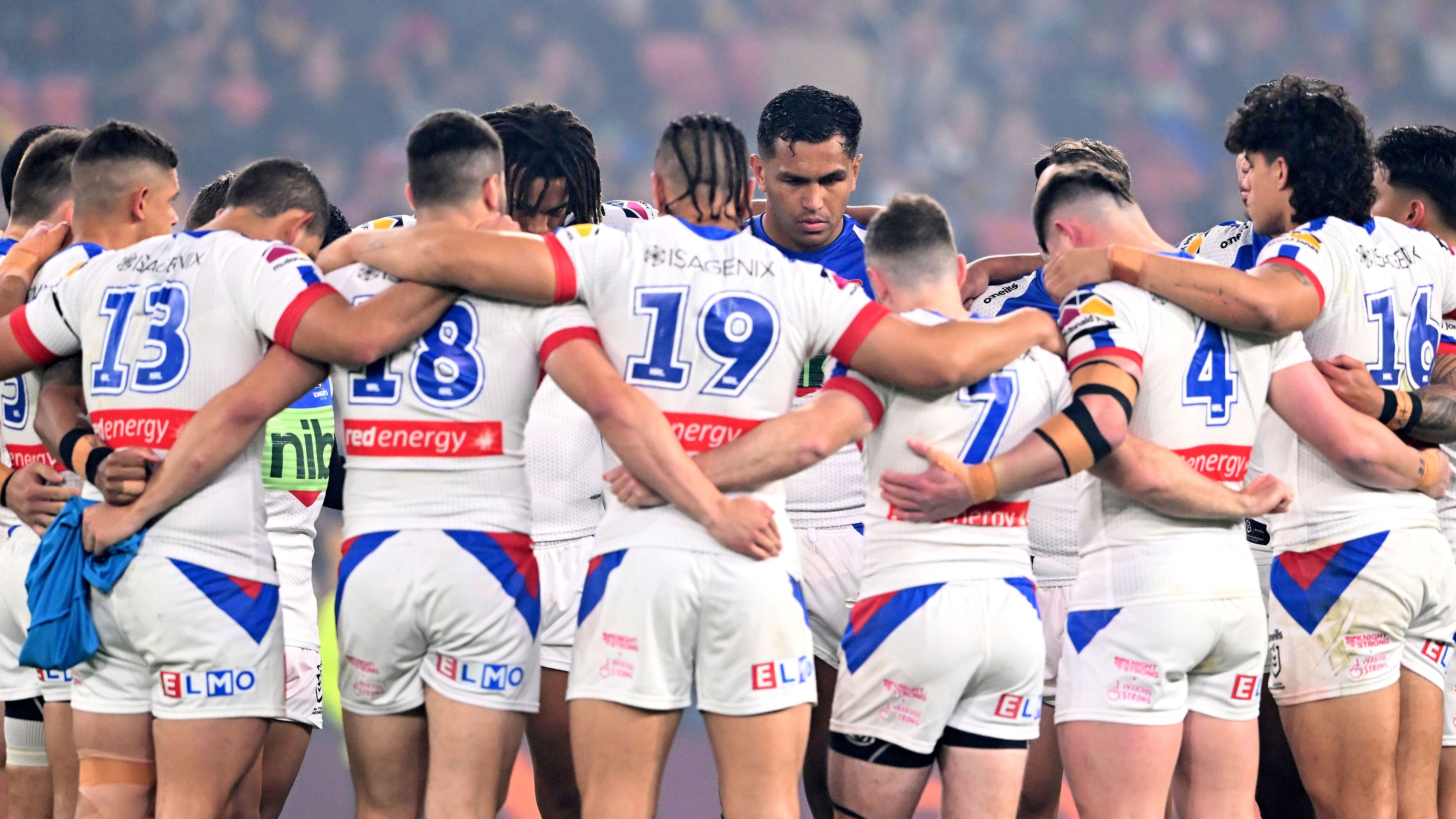 Newcastle Knights players come together before their Broncos clash.