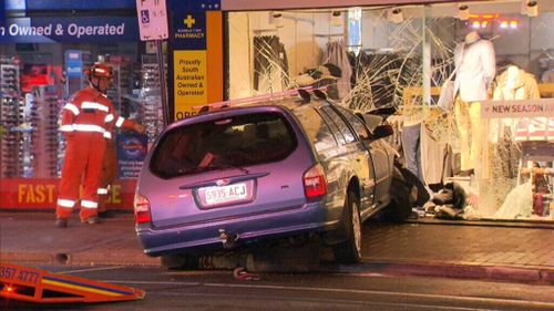 Man hospitalised after car crashes through Adelaide clothing shop
