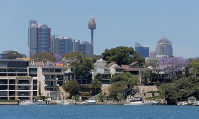 Sydney office buildings and commercial real estate appear behind Sydney waterfront properties