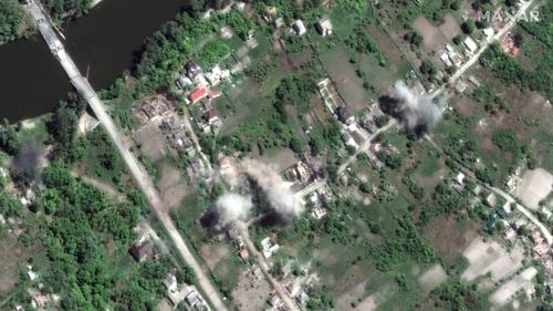 This satellite image provided by Maxar Technologies shows active artillery shelling in the town of Bogorodichne, Ukraine, northwest of Slovyansk, on Monday, June 6, 2022. (Maxar Technologies via AP)