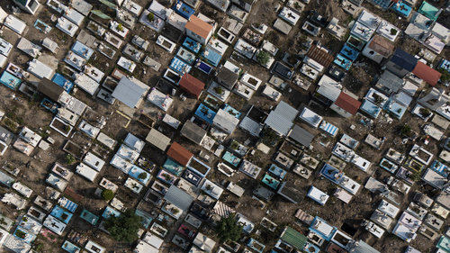 The San Isidro cemetery, that the city's authorities ordered temporarily closed to the public to keep crowds away as a measure to limit the spread of COVID-19 disease, is seen from the air in Mexico City, Sunday, May 10, 2020. (AP Photo/Fernando Llano)