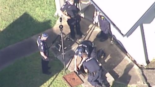 Police were called to the Brighton property, which was being used by Autism Queensland, after human remains were discovered in a disused septic tank. (9NEWS)