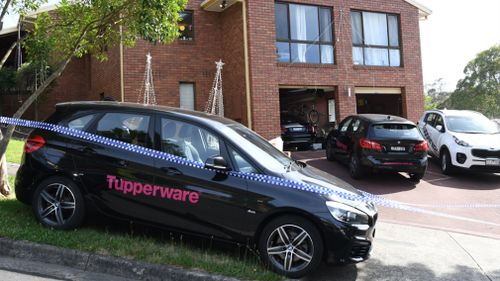 Tupperware vehicles remained parked outside the property yesterday. (AAP)