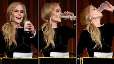 Nicole Kidman drinks a glass of milk on stage at the National Board of Review Gala, January 7, 2025