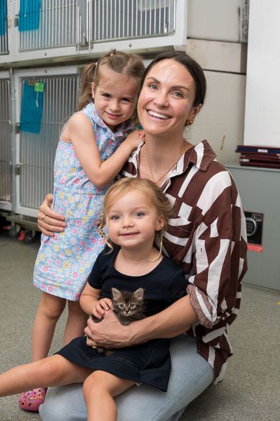 Laura Byrne at Sydney Dogs and Cats Home for Petstock with daughters Marlie-Mae and Lola and their new kitten Raspberry.
