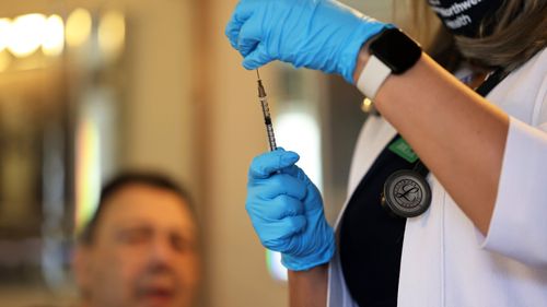 A US health worker prepares a dose of the Johnson & Johnson coronavirus in New York.