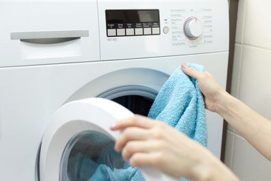 Person loading laundry