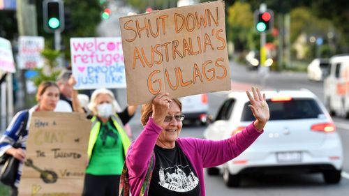 Protestors are seen outside the Kangaroo Point Central Hotel in Brisbane, Friday, June 12, 2020.