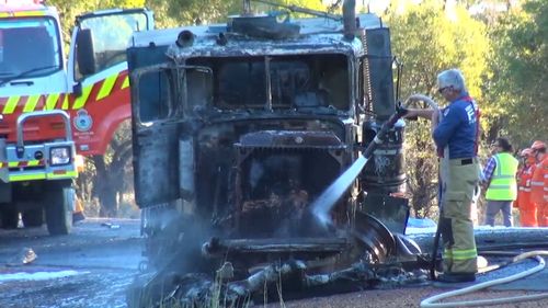 The truck driver managed to escape before his cabin caught alight. (9NEWS)