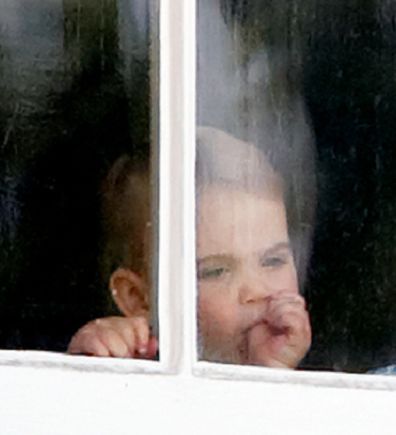 Prince Louis was seen sucking his thumb through a window of Buckingham Palace.