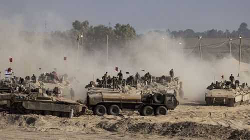  Israeli troops are seen near the border with Gaza on August 6.