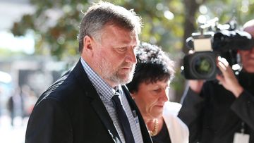 Greg and Virginia Hughes, the parents of cricketer Phillip Hughes, leave the Downing Centre Court in Sydney. (AAP)