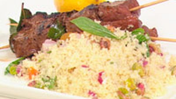 Barbecued beef kebabs with couscous salad