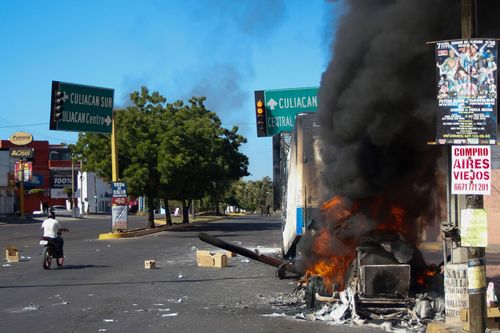 A truck burns after being set on fire in Culiacan, Sinaloa state, Mexico