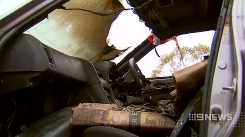 The stolen car was found alight near a last with the engine removed in Caroline Springs. (9NEWS)