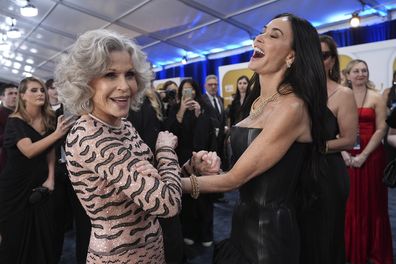 Jane Fonda, left, and Demi Moore arrive at the 31st annual Screen Actors Guild Awards on Sunday, Feb. 23, 2025, at the Shrine Auditorium in Los Angeles. 