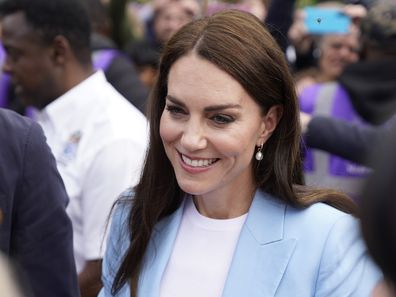 Britain's Kate the Princess of Wale, speaks to members of the public, during a walkabout on the Long Walk near Windsor Castle where the Coronation Concert to celebrate the coronation of King Charles III and Queen Camilla is being held, in Windsor, England, Sunday May 7, 2023. (Andrew Matthews/Pool Photo via AP)