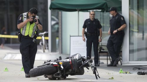 A police officer photographs a motorcycle after a female stunt driver working on the movie "Deadpool 2" died after a crash on set. (AP)