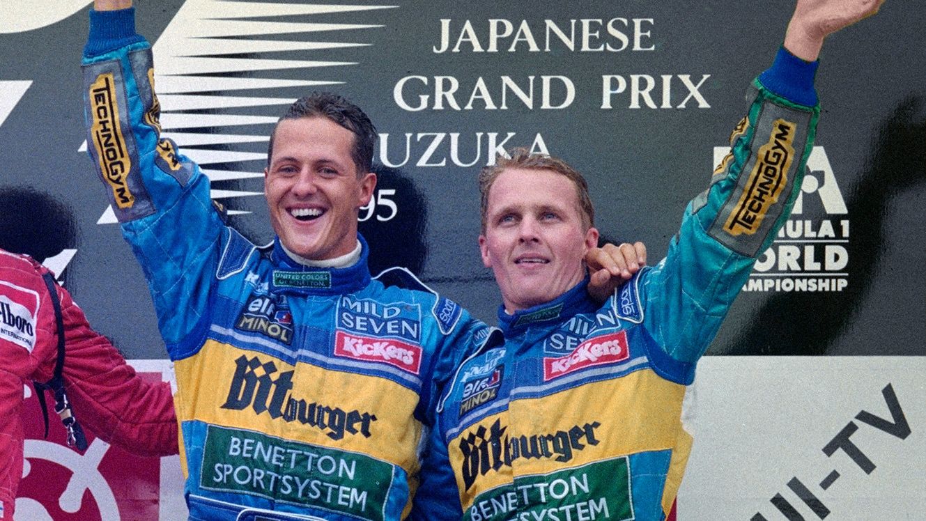 CROPPED: Michael Schumacher of Germany and driver of the #1 Mild Seven Benetton Renault Benetton B195Renault RS7 V10 celebrates with third placed team mate Johnny Herbert ( R ) after winning the Japanese Grand Prix on 29 October 1995 at the Suzuka Circuit, Suzuka, Japan. (Photo by Pascal Rondeau/Allsport/Getty Images)