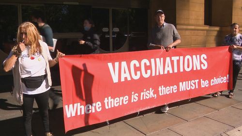 Anti-vaccine mandate protesters outside the South Australia Supreme Court.