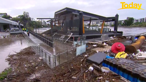 Flood debris is mounting at Howard Smith Wharves.