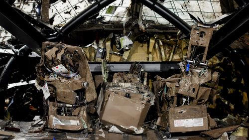 A view of the rebuilt cockpit section of the rebuilt fuselage of Malaysia Airlines flight MH17.