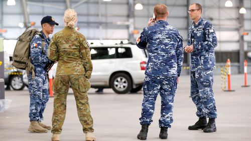 ADF personnel assist with a COVID-19 testing at Melbourne Showgrounds 