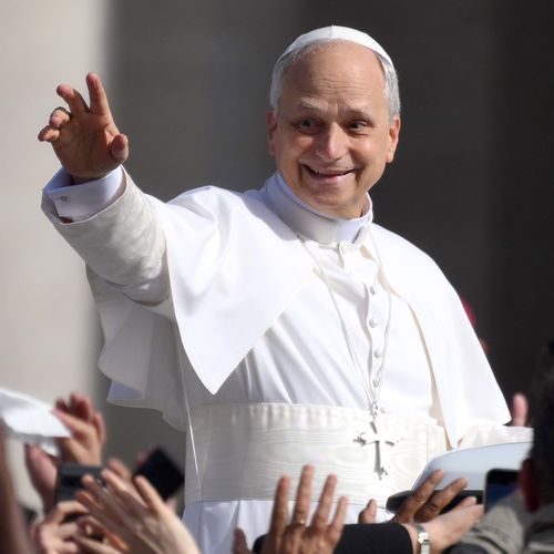 Pope Leo XIV waves as he arrives ahead of the Inauguration Mass of Pope Leo XIV in St Peter's Square.