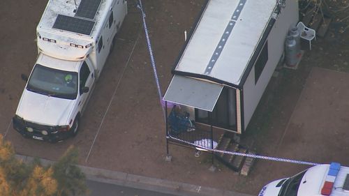 A man has been shot by police during a siege at a carvan park in Sydney's south-west.