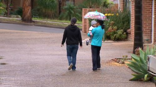 Aidan Fenton's father with a family friend today. (9NEWS)