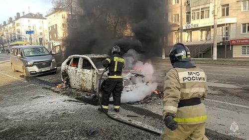 Burning cars and plumes of black smoke after Ukraine shelling