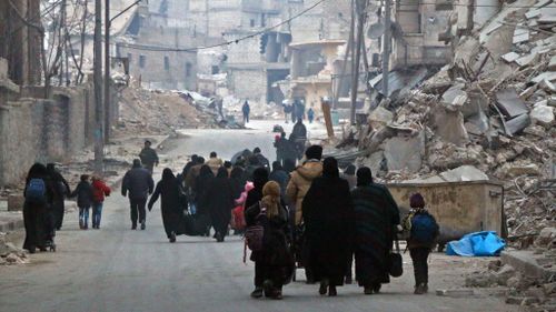 Civilians flee their homes in Aleppo. (AFP)