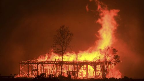 More than a dozen wildfires whipped by powerful winds been burning though California wine country. (AAP)