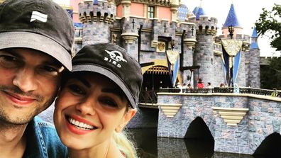 Ashton Kutcher and Mila Kunis at Disneyland