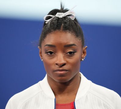 TOKYO, JAPAN - JULY 27: Simone Biles of Team US reacts during the Women's Team Final of the Tokyo 2020 Olympic Games at Ariake Gymnastics Centre in Tokyo, Japan on July 27, 2021. 