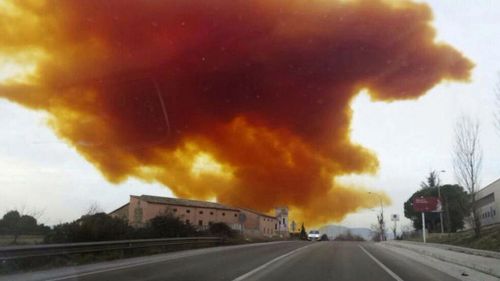 The toxic orange cloud above the town of Igualada. (AAP)