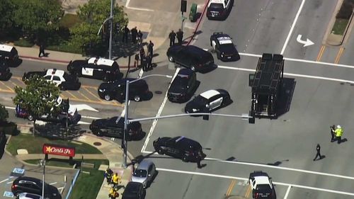 Police gather outside the YouTube headquarters. (ABC America)