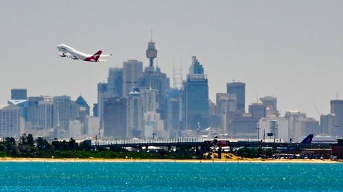 A Qantas plane takes off from Sydney Airport.