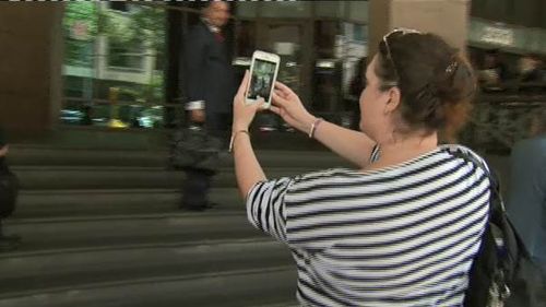 Malkah took a quick selfie with the media outside court. (9NEWS)