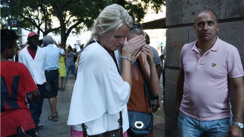 Distressed witnesses near Las Ramblas. (AP)