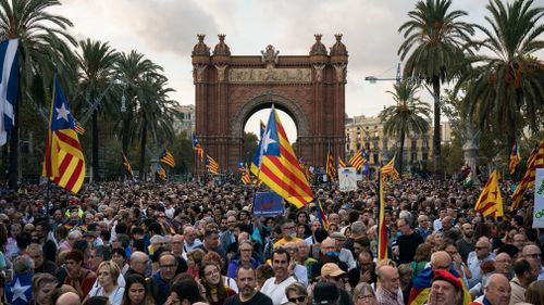 Pro-independence supporters holding Catalan flags take part in rally near the Parliament, in Barcelona, Spain. (AP)