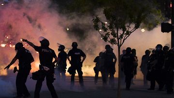 Police officers fire tear gas at protesters near the Colorado state capitol during a protest on May 29, 2020 in Denver, Colorado. This was the second day of protests in Denver, with more demonstrations planned for the weekend.