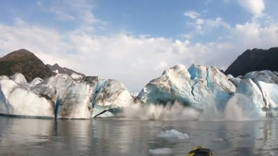 They were shocked when a huge wall of ice calved off the glacier. 