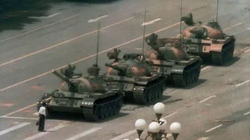 An unidentified person known as 'tank man' stands before tanks in China's Tiananmen Square during pro-democracy demonstrations in June 1989 in one of the most enduring images of the conflict.