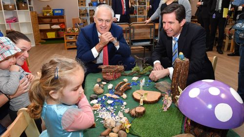 Prime Minister Malcolm Turnbull and Minister for Education Simon Birmingham with pre-school children at a child care centre last March. (AAP)