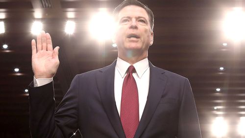 Sacked FBI director James Comey swears an oath. (AAP)